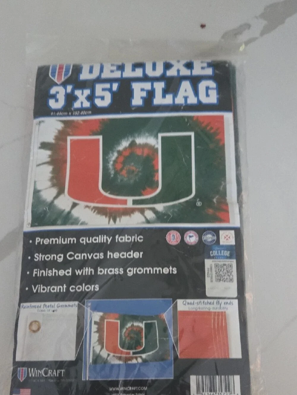 The University Of Miami Wincraft Tie-Dye U Logo Flag in Orange and Green